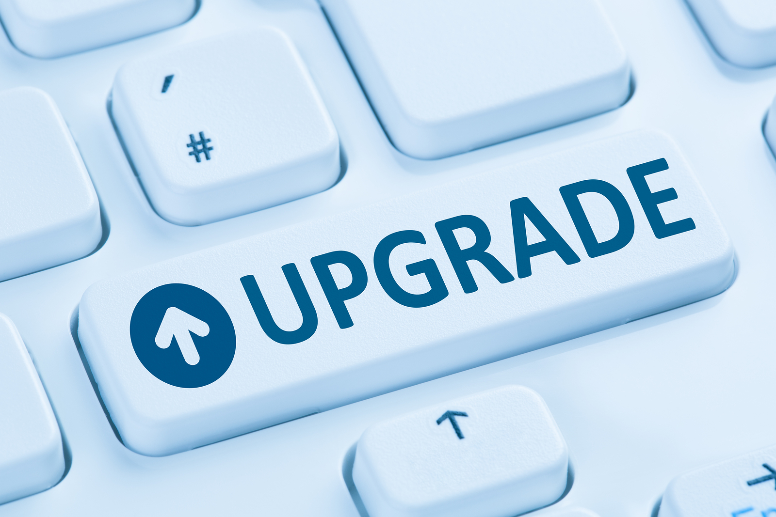 Upgrade upgrading software program symbol blue computer keyboard