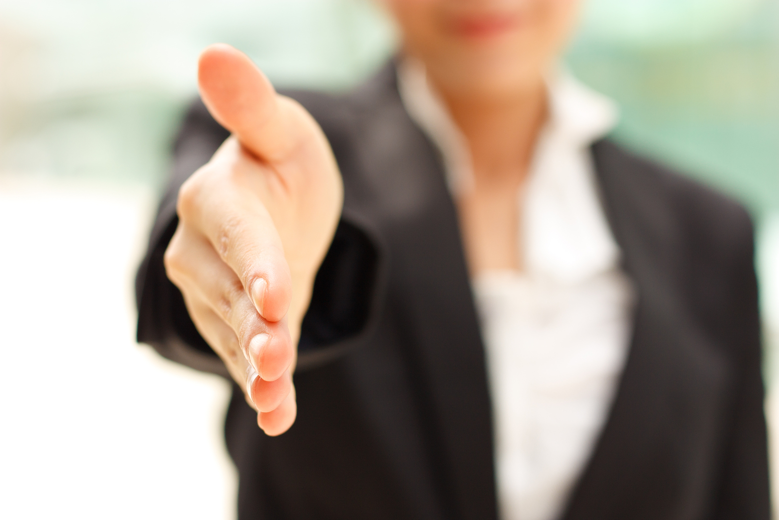 Business woman gives a handshake