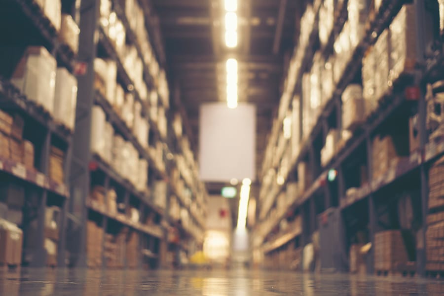 Blurry background of Warehouse inventory product stock for logistic background