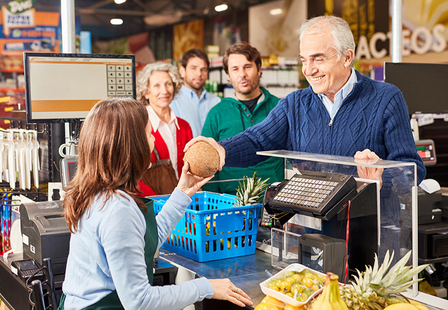 Customer paying at the supermarket cashier