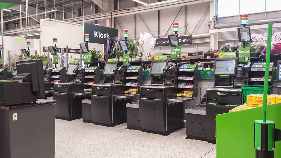 Peterlee / Great Britain - May 23, 2019 : Self service area in modern supermarket showing self-service pay point tills