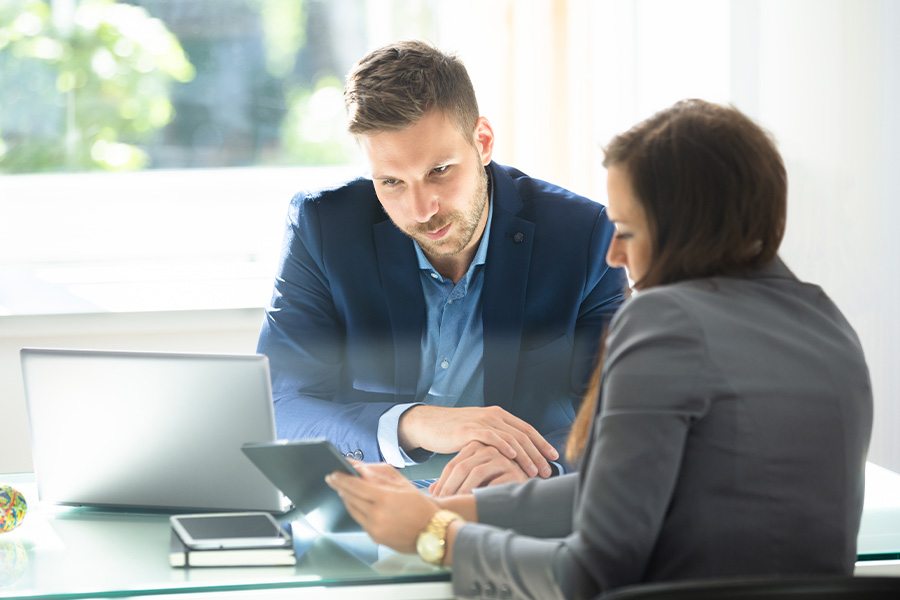 Two business people using multi-store pos software