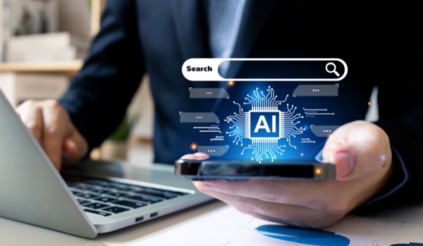 Staying Ahead: Answer Engine Optimization for VARs A business professional holding a smartphone with an AI-driven search interface, representing the importance of Answer Engine Optimization (AEO) for website performance in the VAR industry.