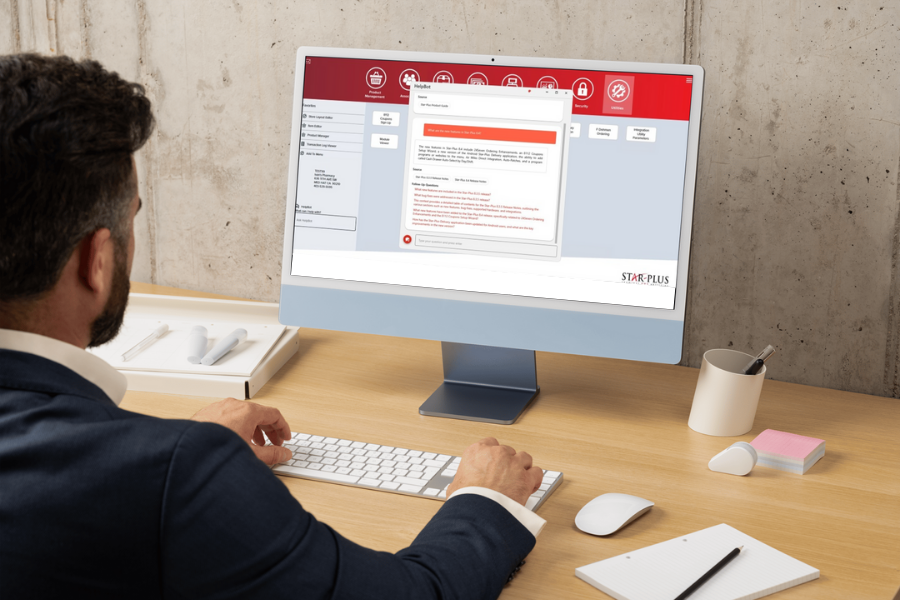 Business professional using the Star-Plus POS system on a desktop computer with the HelpBot interface open on screen.