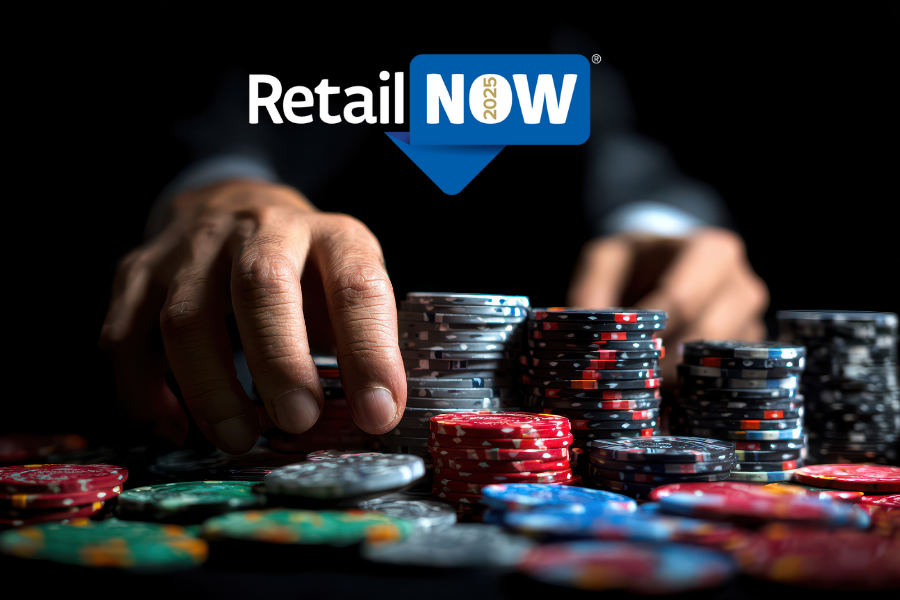 Close-up of hands stacking casino chips at a dark poker table, symbolizing high-stakes decisions at RetailNOW! 2025.